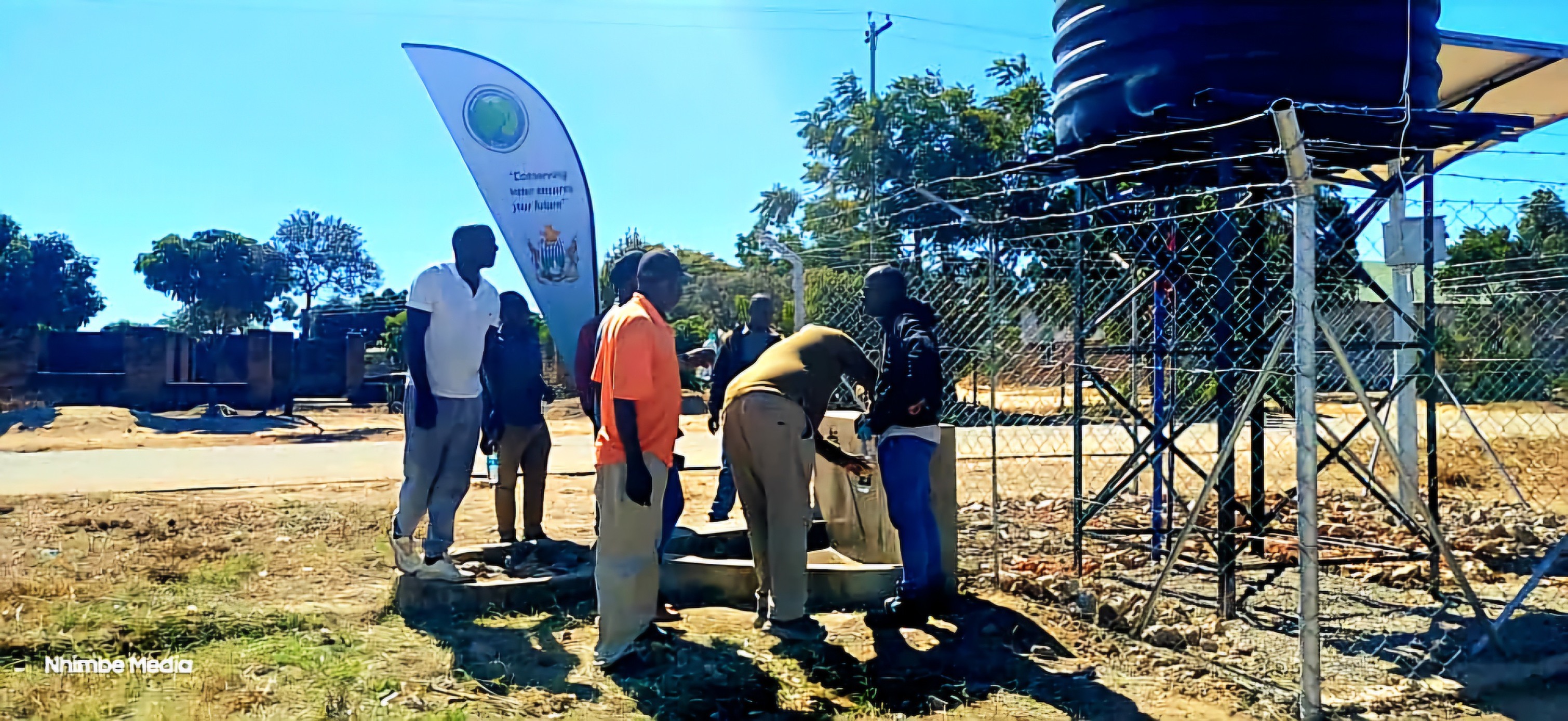 Community members gathered at the solar borehole handover in Magamba