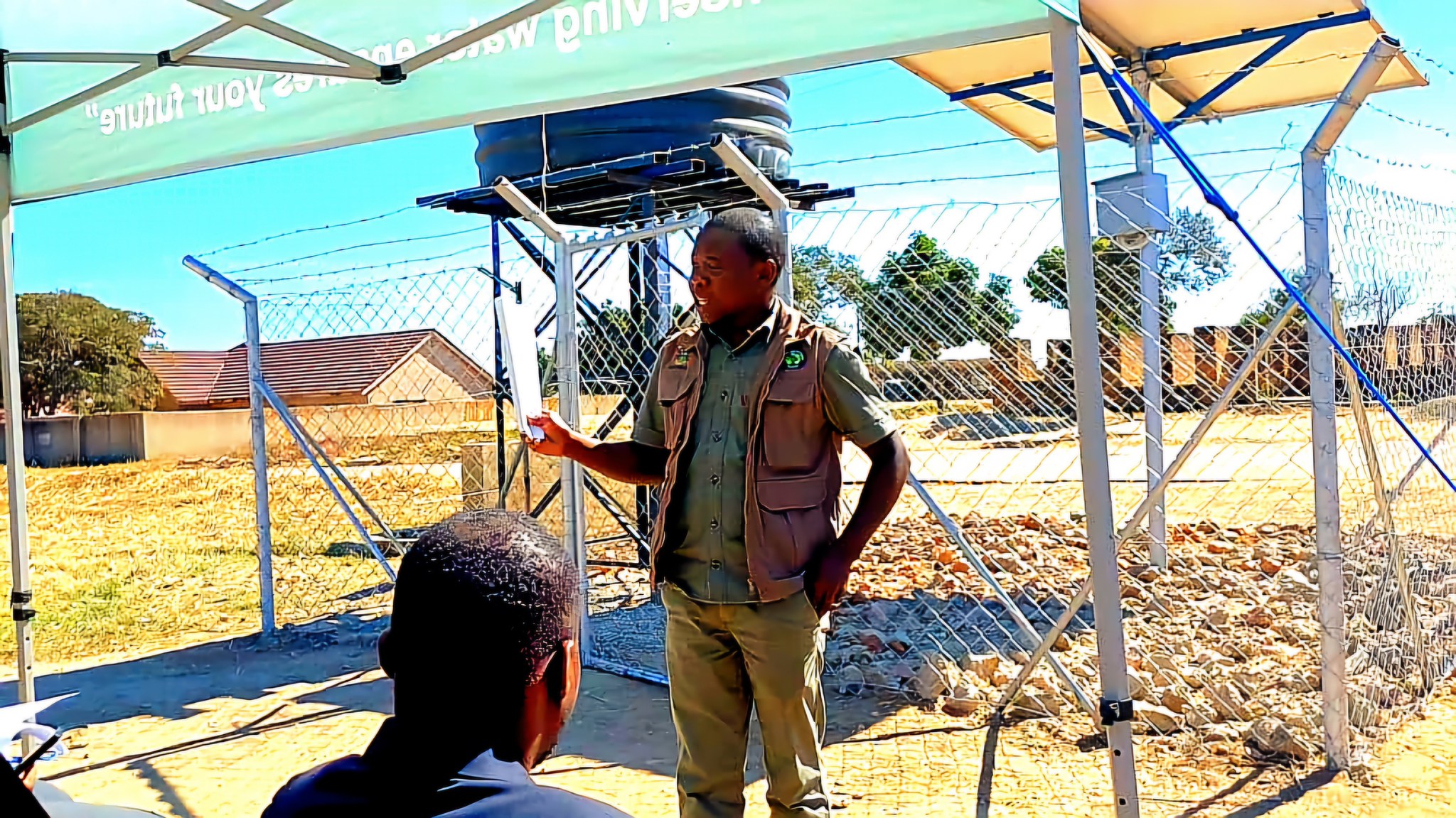 Speaker addressing stakeholders at the Magamba solar borehole handover